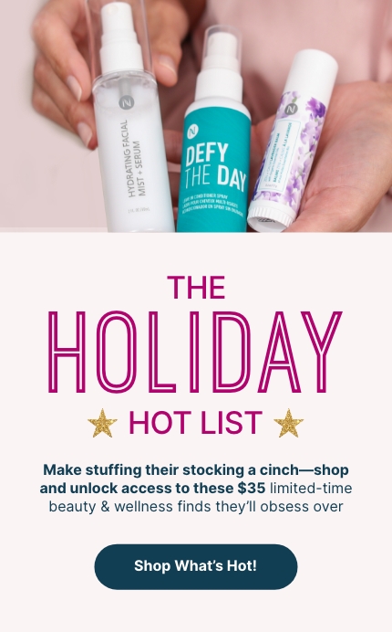 Woman holding Neora’s Holiday Hot List must-haves: Lip Plumping Serum, Hydrating Facial Mist and Zen + Calm Lavendar Balm. 