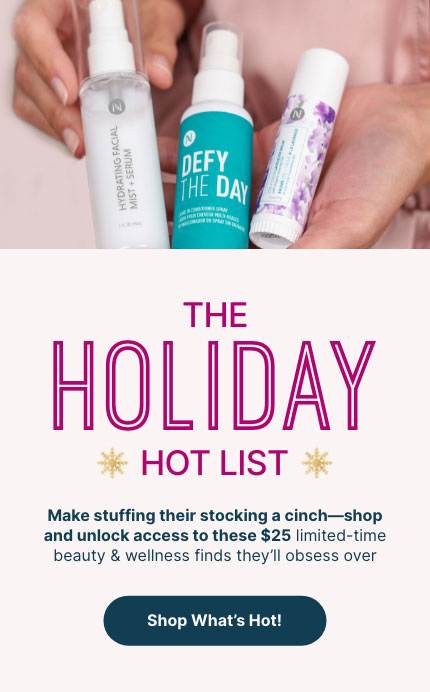 Woman holding Neora's Holiday Hot List must-haves: Lip Plumping Serum, Hydrating Facial Mist and Zen + Calm Lavendar Balm. 
